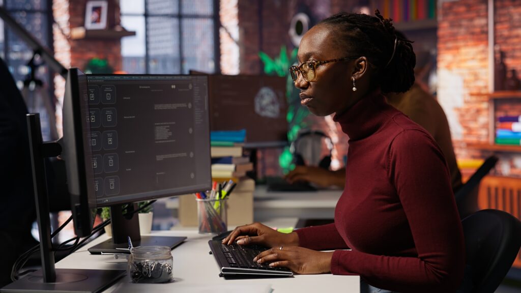 startup worker using ai llm chatbot to get help with coding tasks